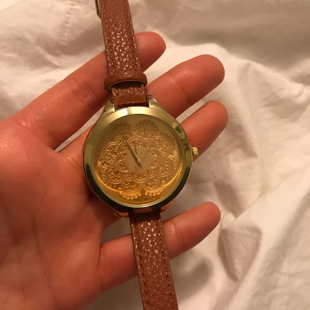 Gold watch with brown leather strap